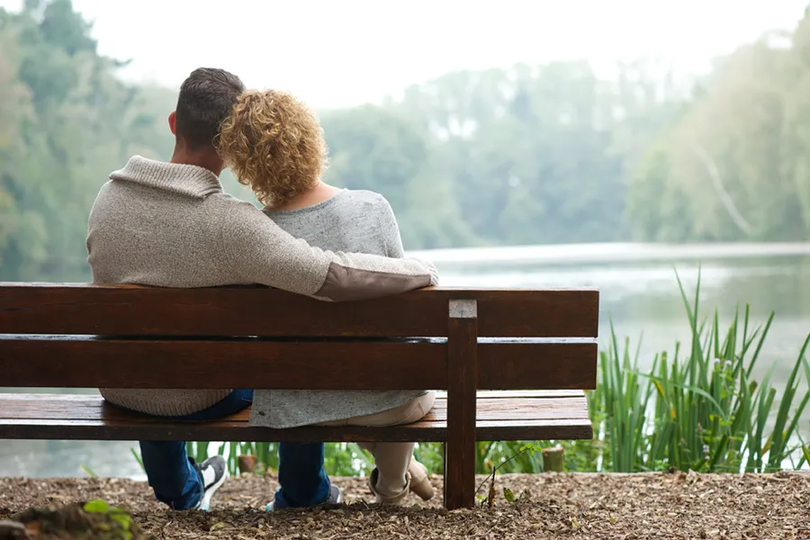 Allergy-Treatment-Clinic A couple relaxes on a bench by a pond. Get Allergy Relief from Dr. David Lans in New Rochelle.