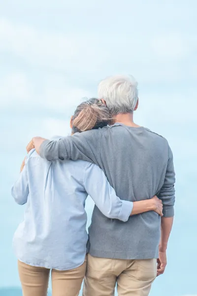 Rapamycin-Treatment A middle-aged couple looking out onto the ocean. Get Rapamycin treatment from Dr. David Lans in New Rochelle.